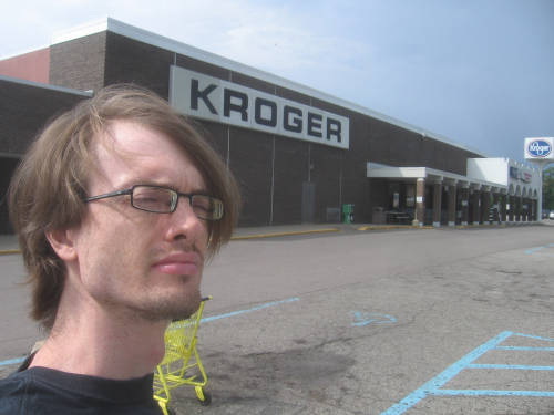 [Andrew standing in front of the recently-closed Kroger Superstore in Jackson, Michigan]