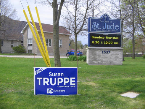[Progressive Conservative campaign sign in front of an Anglican church]