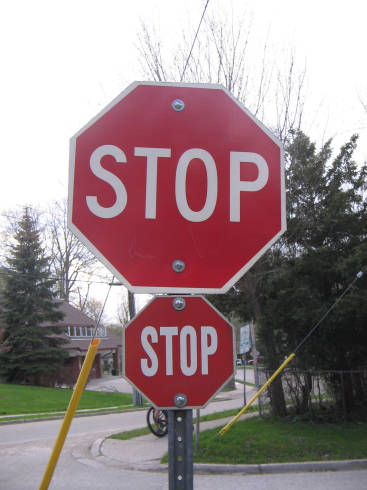 [Two Stop signs in London, Ontario]