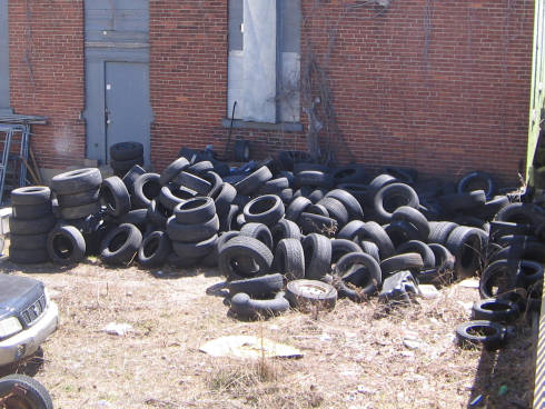 [Field full of tires (not on fire, thankfully)]