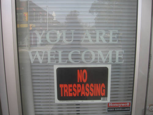 [You are Welcome/No Trespassing signs]