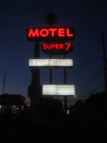 [Super 7 Motel at night]