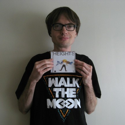 [Andrew holding a Walk the Moon CD]